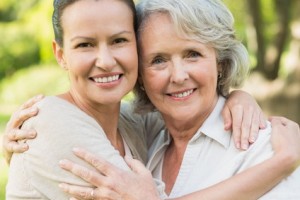 Smiling mature woman with adult daughter